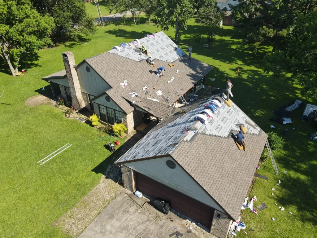 Roofing professional repairing a roof, ensuring durability and weather protection.