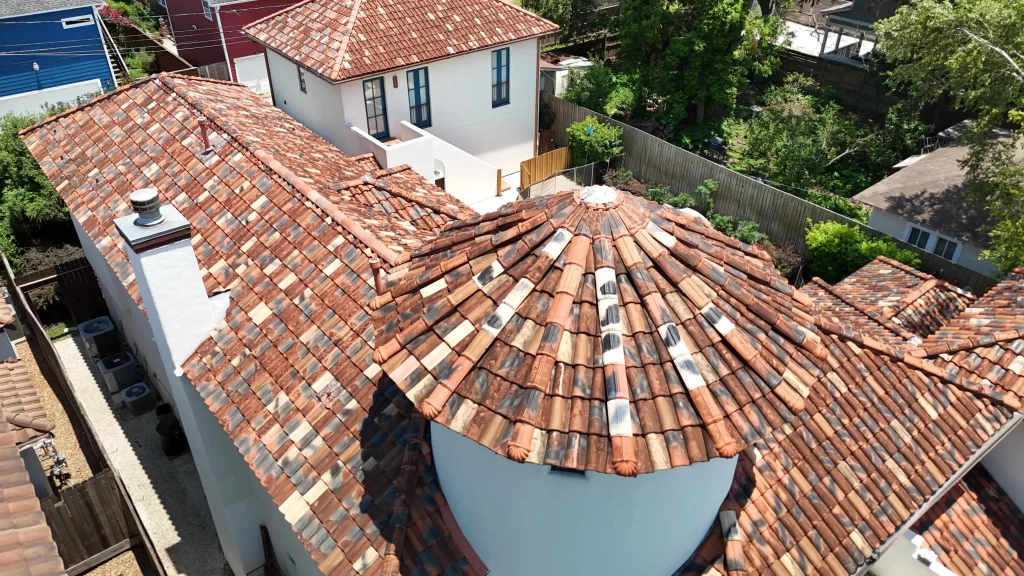 Clay or concrete tile roofing on a sloped roof, showcasing durability, weather resistance, and a classic aesthetic.